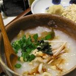 Chinese porridge in a wooden bowl