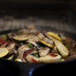 Assorted sliced vegetables on a heated pan