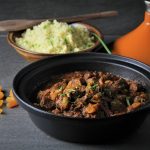 Pork tagine in a black bowl