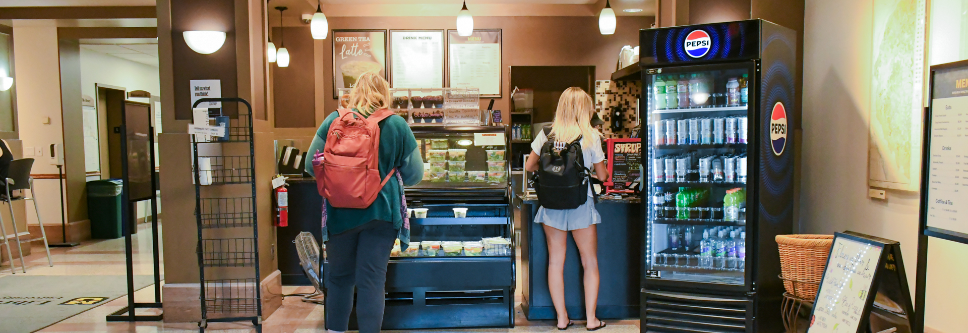 Students ordering at a cafe counter