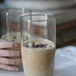 Light brown smoothie in a glass clup
